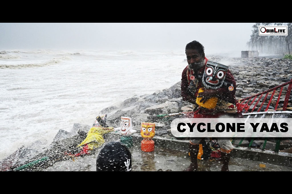 The priest with Lord Jagannath idol during Cyclone Yaas